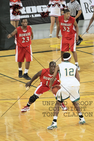 Moses Sundufu Guarding The Ball With Josh Watkins And Carlos Emory In The Background